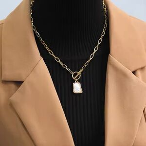 Gold plated stainless steel necklace with a mother of pearl pendant